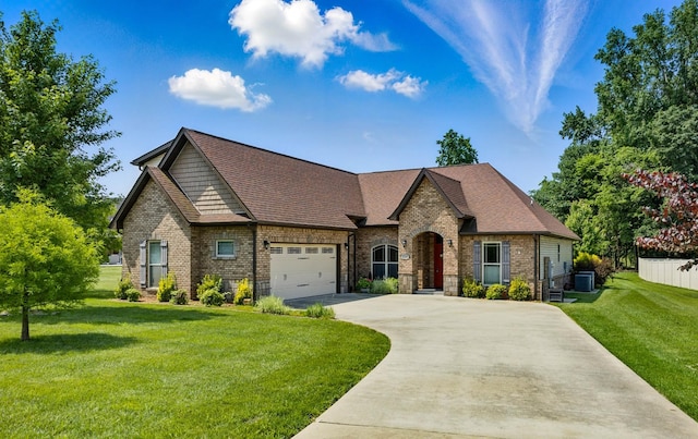4268 Sango Rd, Clarksville, TN 37043 - french country inspired facade featuring driveway, brick siding, a front yard, an attached garage, and central AC unit