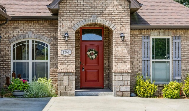 4268 Sango Rd, Clarksville, TN 37043 - property entrance with roof with shingles, brick siding, and stone siding