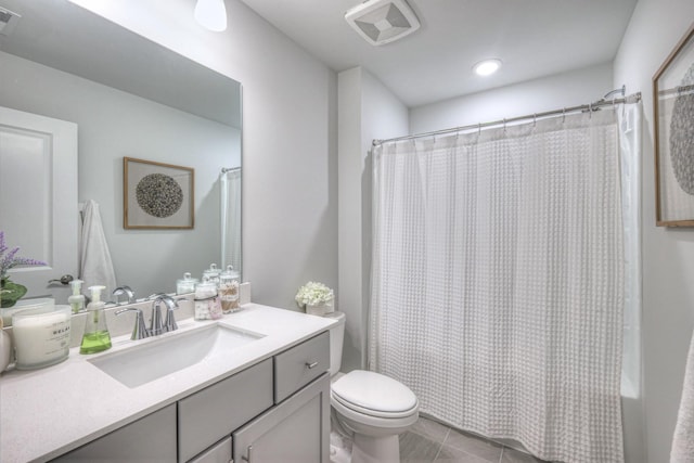 bathroom featuring visible vents, vanity, toilet, and tile patterned floors