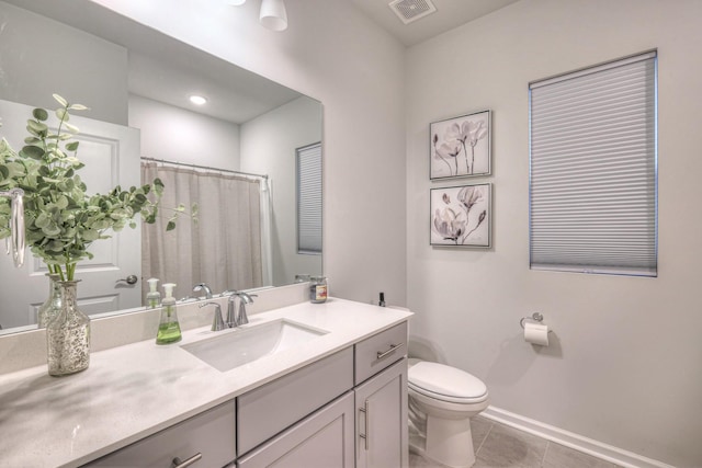 full bath with visible vents, toilet, vanity, baseboards, and tile patterned floors