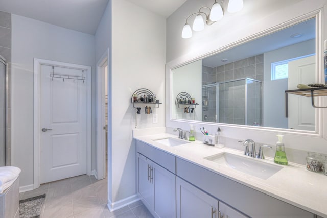 full bath featuring a spacious closet, a sink, a shower stall, and double vanity