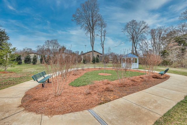 view of home's community featuring a gazebo and a lawn