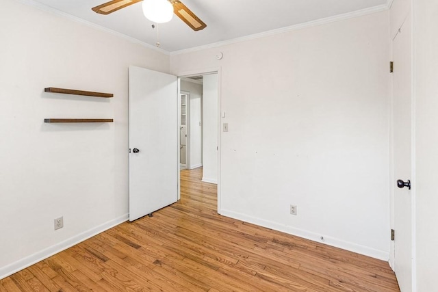 unfurnished bedroom with light wood finished floors, baseboards, ornamental molding, and a ceiling fan