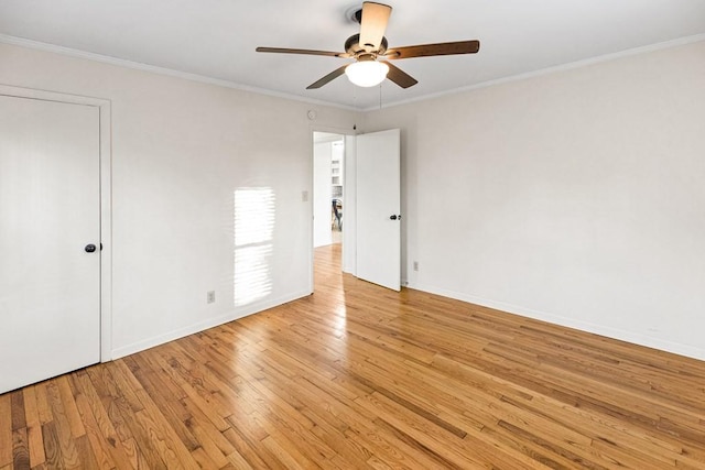 unfurnished bedroom featuring baseboards, ceiling fan, light wood finished floors, and crown molding