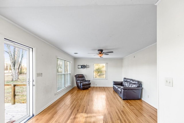 unfurnished room with light wood-type flooring, ceiling fan, and ornamental molding