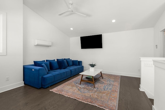 living room featuring ceiling fan, vaulted ceiling, wood finished floors, and a wall mounted AC