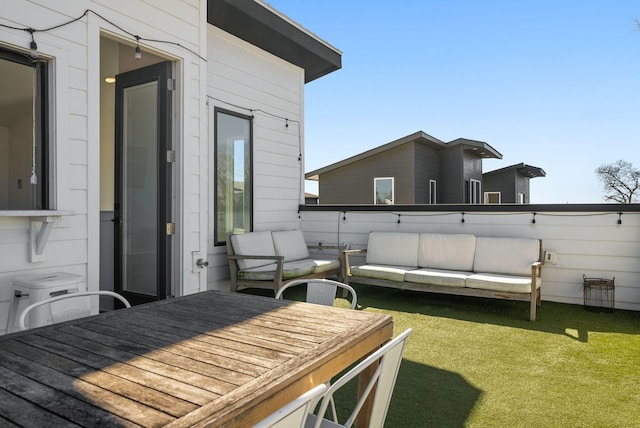 exterior space featuring a yard and an outdoor living space