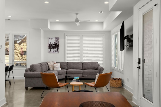 living room featuring recessed lighting, visible vents, and a healthy amount of sunlight