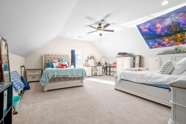 carpeted bedroom featuring visible vents, vaulted ceiling, and a ceiling fan