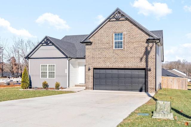 traditional home with a garage, brick siding, concrete driveway, roof with shingles, and a front yard