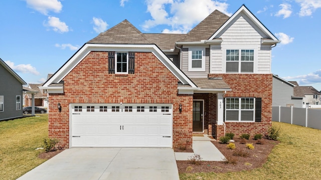 view of front of home featuring driveway, fence, a front lawn, and brick siding