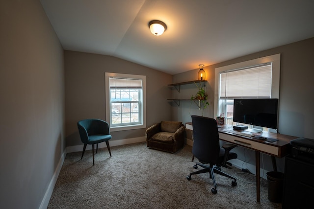 office area featuring carpet, vaulted ceiling, and baseboards