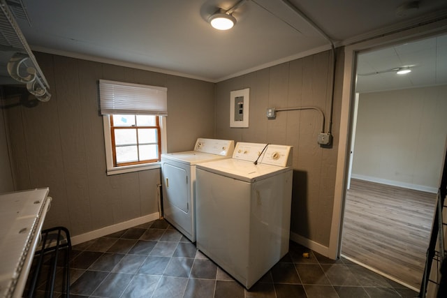 laundry room featuring laundry area, separate washer and dryer, electric panel, and baseboards