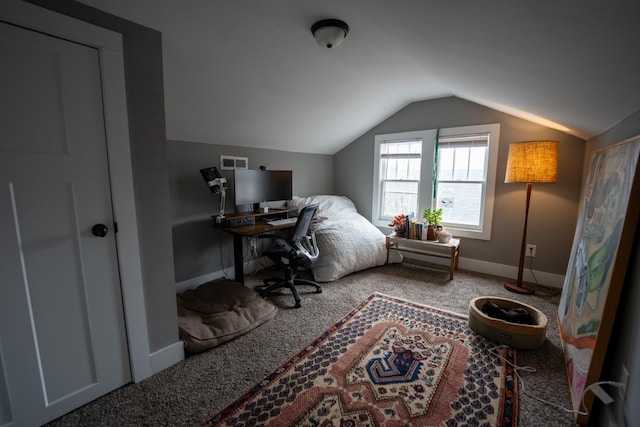 carpeted bedroom featuring vaulted ceiling and baseboards