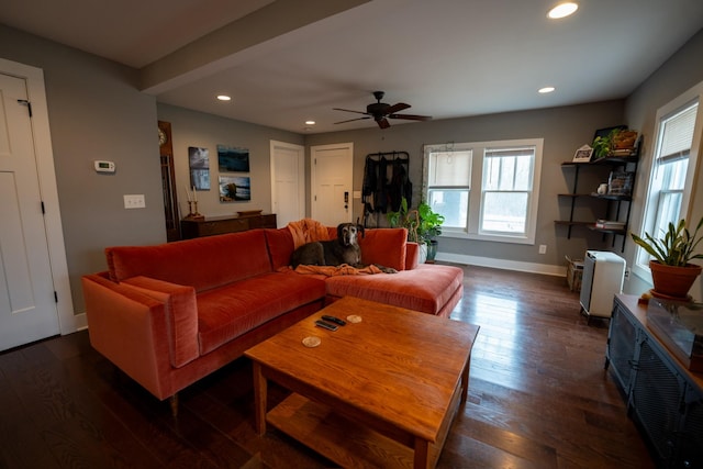 living area with baseboards, dark wood-style flooring, recessed lighting, and a healthy amount of sunlight