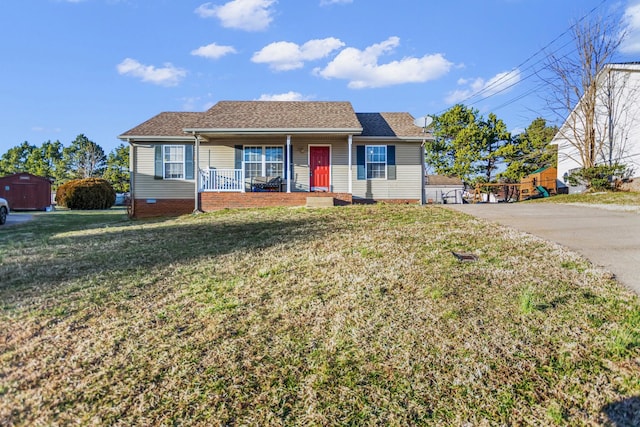 single story home featuring a porch and a front yard