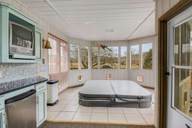 sunroom / solarium with visible vents