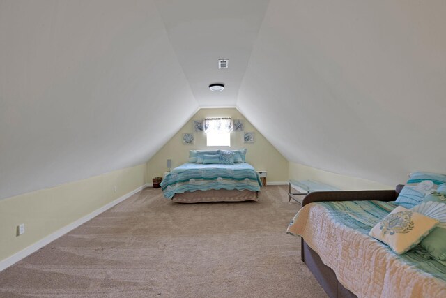 bedroom featuring lofted ceiling, carpet, and baseboards