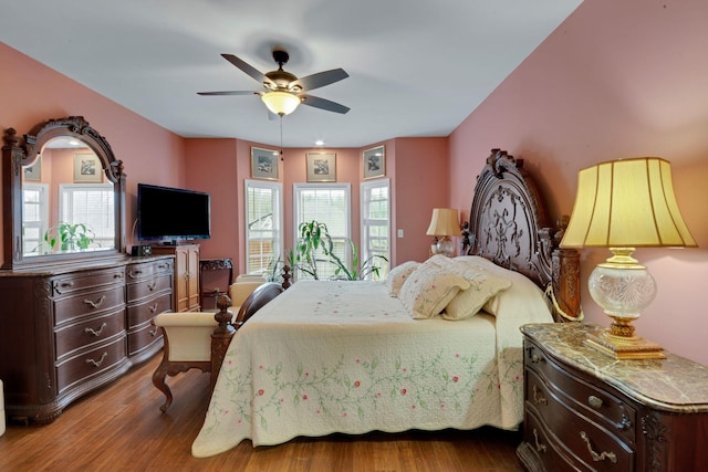 bedroom featuring ceiling fan and wood finished floors