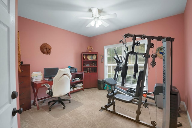 home office with a ceiling fan and carpet flooring