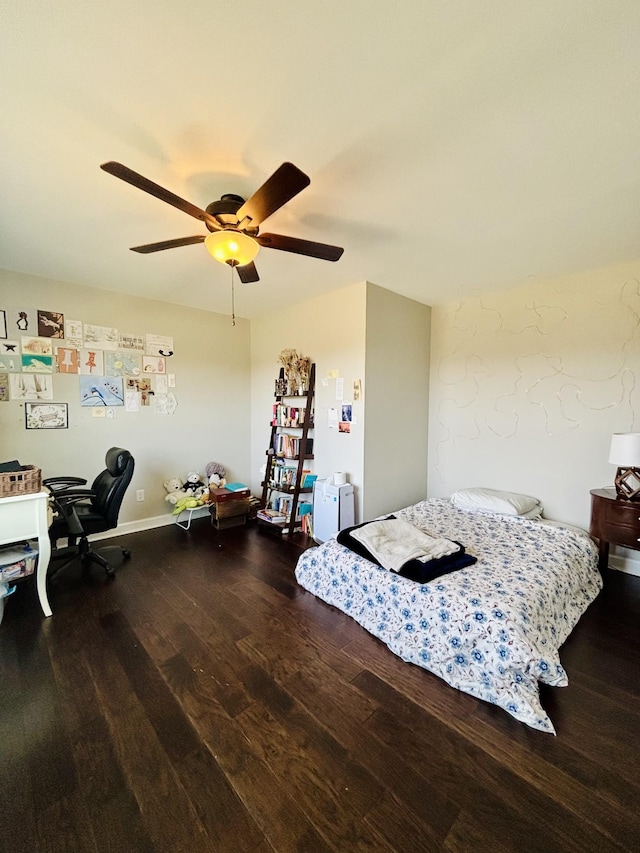 bedroom with wood finished floors and a ceiling fan