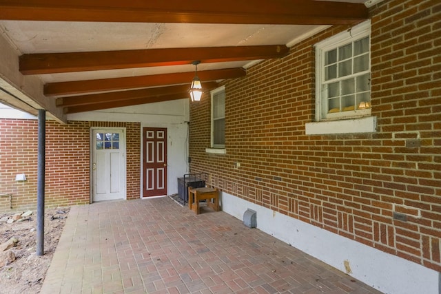 property entrance with brick siding