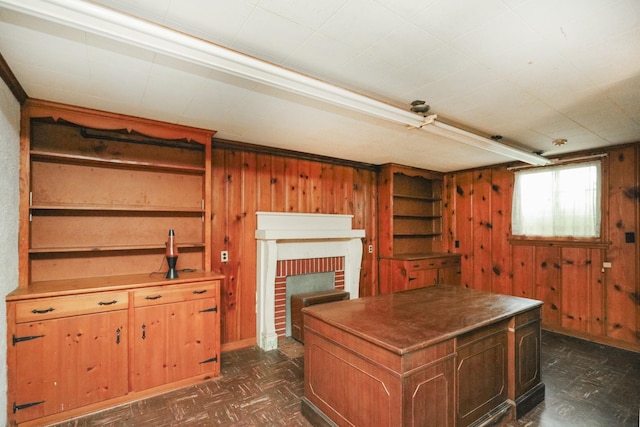 interior space featuring wooden walls and a fireplace