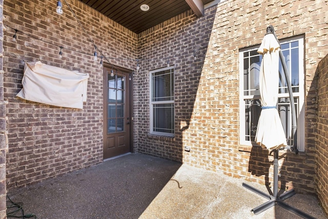 entrance to property with brick siding