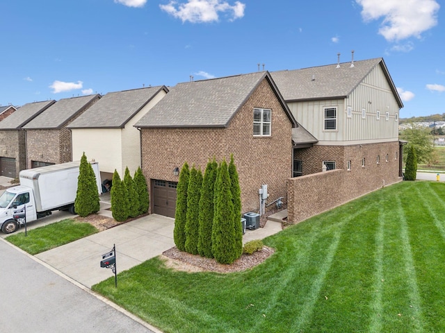 view of home's exterior with brick siding, concrete driveway, an attached garage, and a lawn