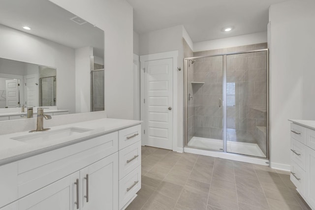 full bath featuring recessed lighting, visible vents, a shower stall, and vanity