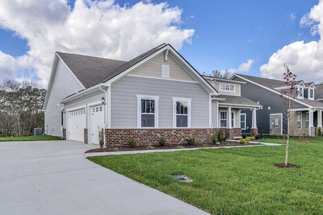 craftsman inspired home with central air condition unit, a garage, brick siding, concrete driveway, and a front yard