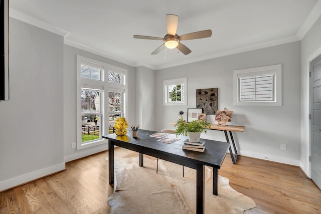 office with ornamental molding, baseboards, and light wood finished floors