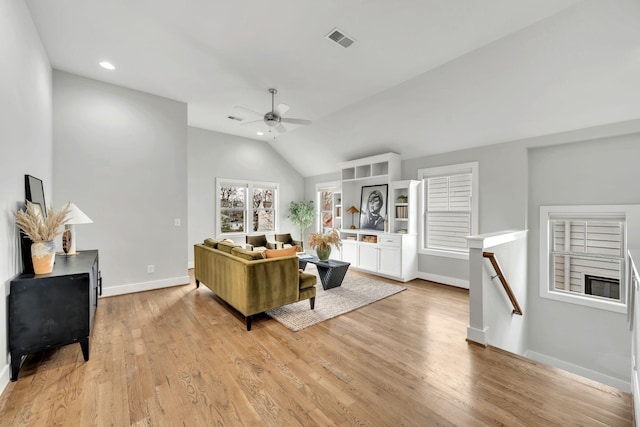 living room featuring baseboards, visible vents, a ceiling fan, light wood-type flooring, and recessed lighting