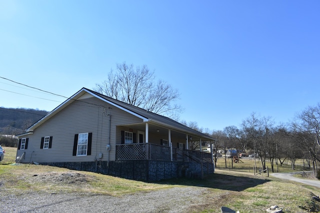 view of home's exterior featuring covered porch