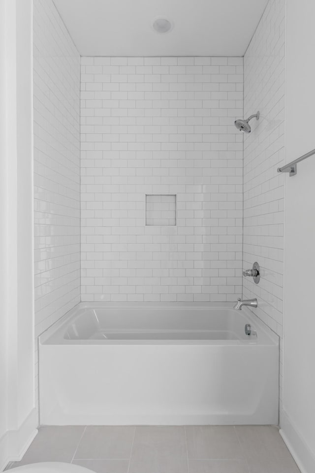 bathroom with bathtub / shower combination and tile patterned floors