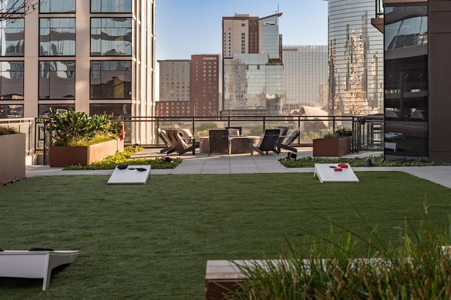 view of yard featuring a view of city and a patio