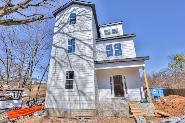 view of front of house featuring fence