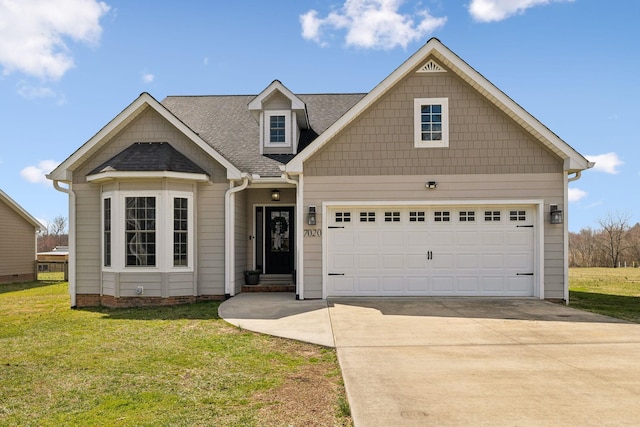 view of front of property featuring a garage, roof with shingles, concrete driveway, and a front yard