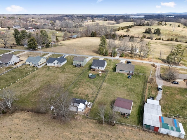 birds eye view of property with a rural view