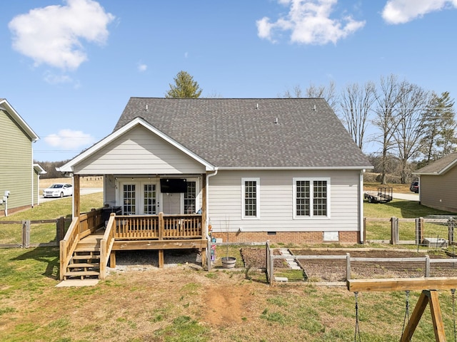 rear view of house featuring a yard, a shingled roof, crawl space, fence, and a wooden deck