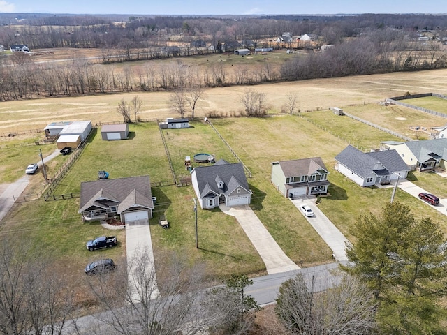 birds eye view of property with a rural view