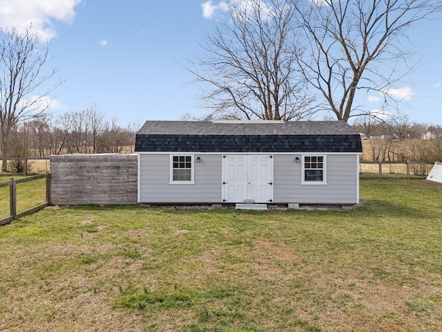 view of outbuilding with an outdoor structure and a fenced backyard