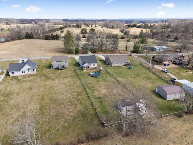birds eye view of property with a rural view