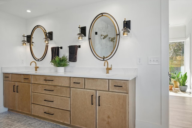 full bathroom featuring double vanity, a sink, and recessed lighting