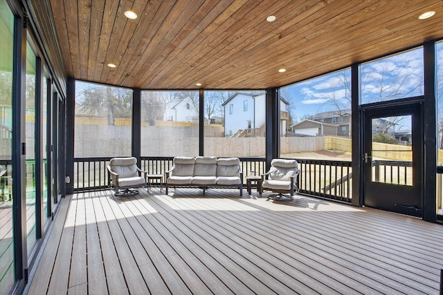 unfurnished sunroom with wooden ceiling