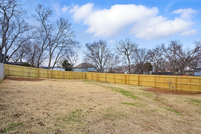 view of yard with a fenced backyard