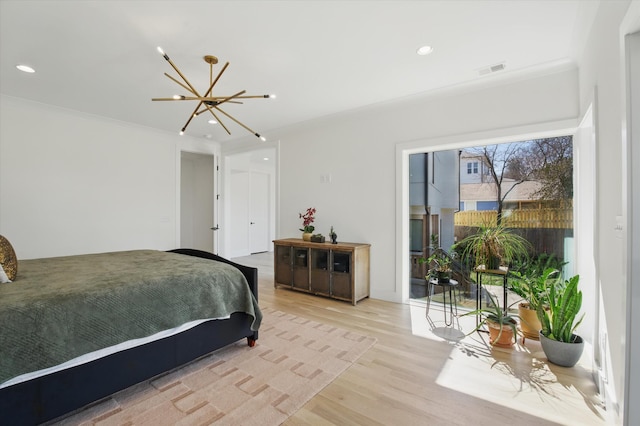 bedroom featuring recessed lighting, visible vents, light wood-style flooring, an inviting chandelier, and ornamental molding