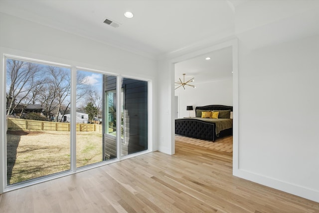 interior space with baseboards, visible vents, wood finished floors, and recessed lighting