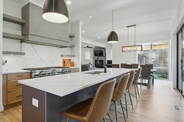 kitchen featuring visible vents, range, light wood-style flooring, and open shelves