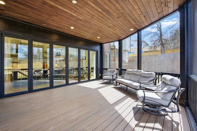 unfurnished sunroom with wood ceiling and a healthy amount of sunlight